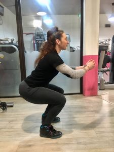 exercice squat fessiers